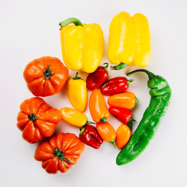 Colorful peppers on white background