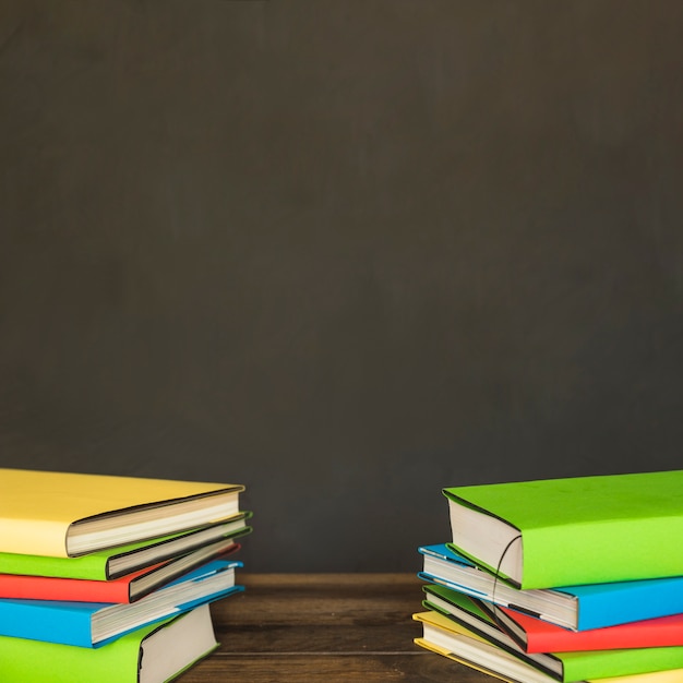 Free photo colorful piles of books on table