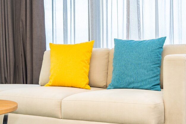 Colorful pillows on beige sofa