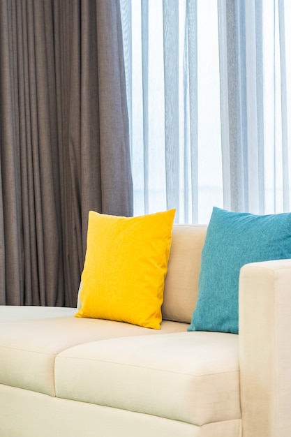 Colorful pillows on beige sofa