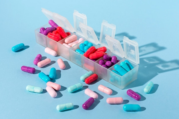 Colorful pills in boxes
