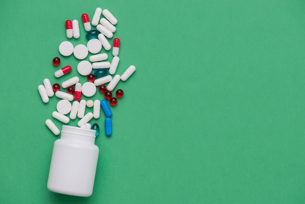 Colorful pills with white container