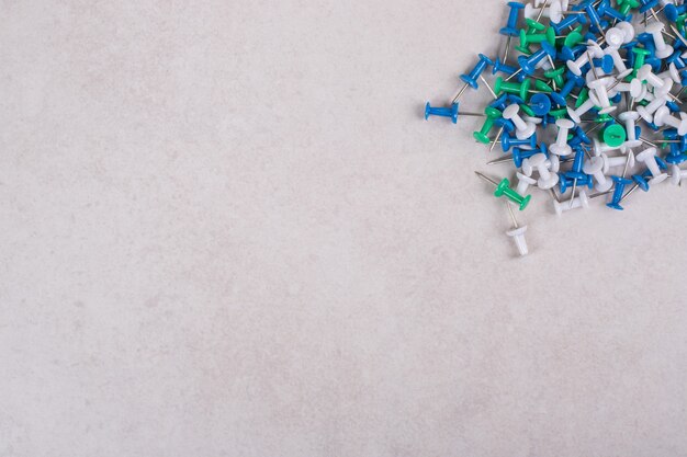 Colorful pins on white background. High quality photo