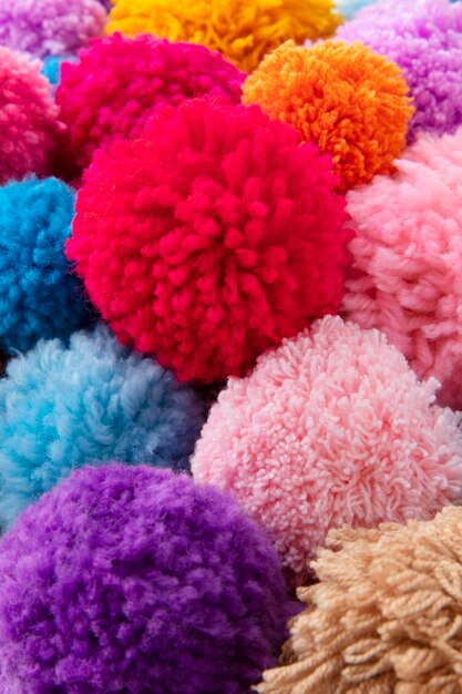 Colorful pom poms arrangement high angle