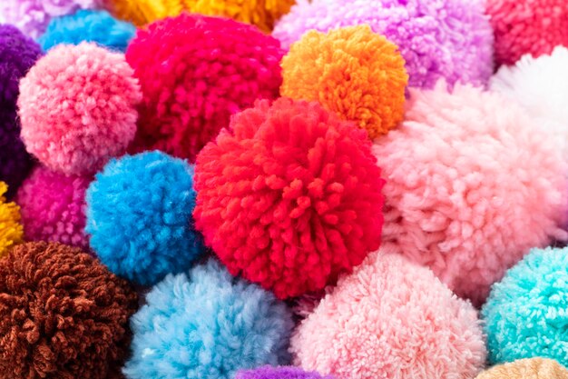 Colorful pom poms arrangement high angle