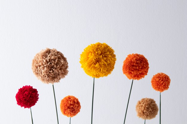 Colorful pom poms arrangement top view