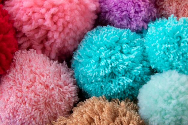 Colorful pom poms arrangement top view