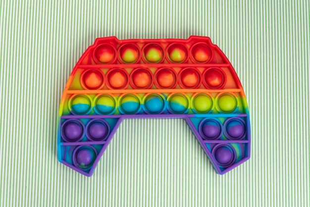 Foto gratuita giocattolo pop it colorato su sfondo - primo piano