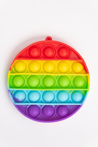 Free photo colorful pop it toy over background - close up