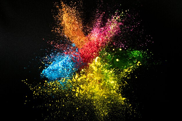 Colorful powder mix splash with dark background