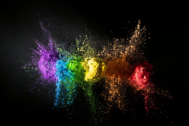 Colorful powder mix with dark background