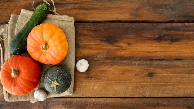 Colorful pumpkins on cloth with copy space