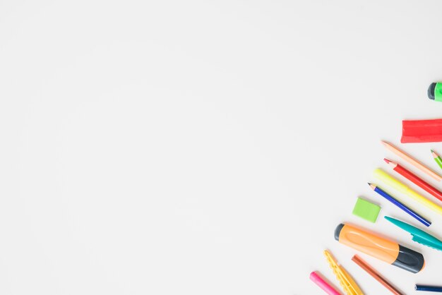 Colorful school accessories on corner of the white background