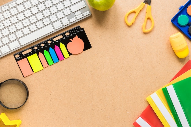 Colorful school and office equipment on beige background