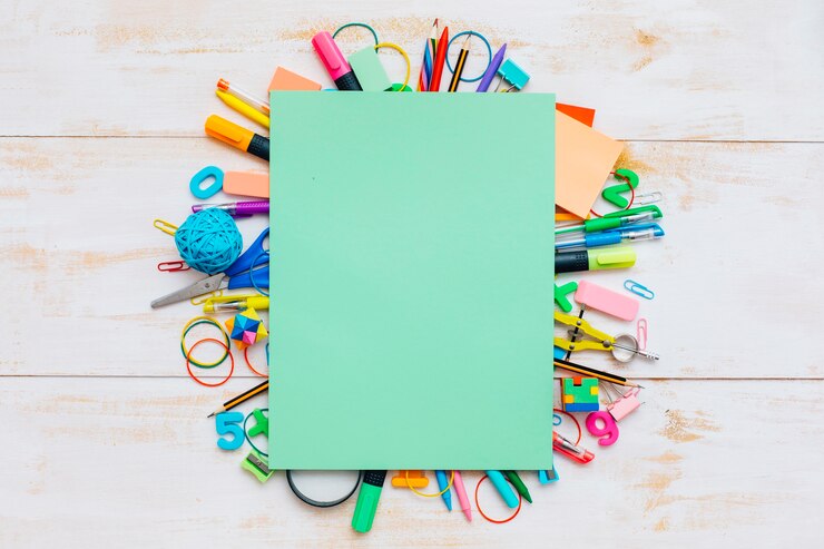 Free Photo colorful school supplies and green paper.