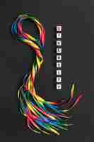 Free photo colorful shoelaces composition on dark background