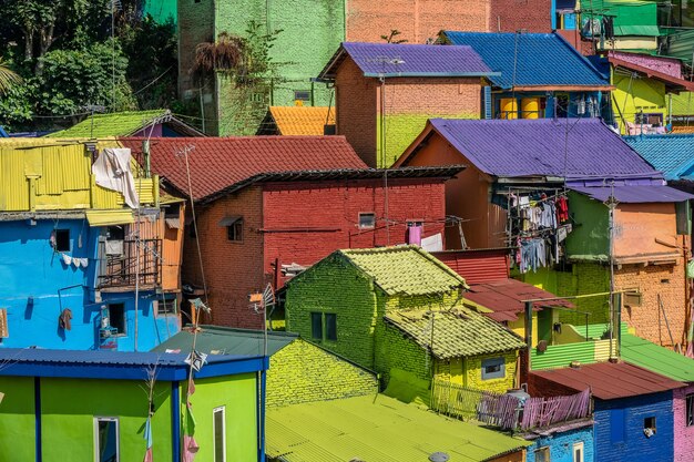 Colorful small houses with clothes hanged outside in a suburban district