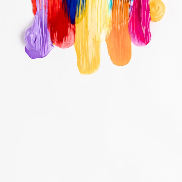 Free photo colorful smeared paint on white background