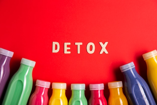 Free photo colorful smoothies with detox lettering