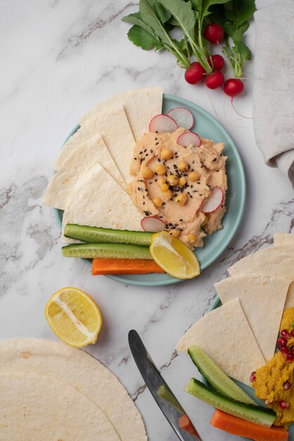 Colorful and tasty hummus with ingredients