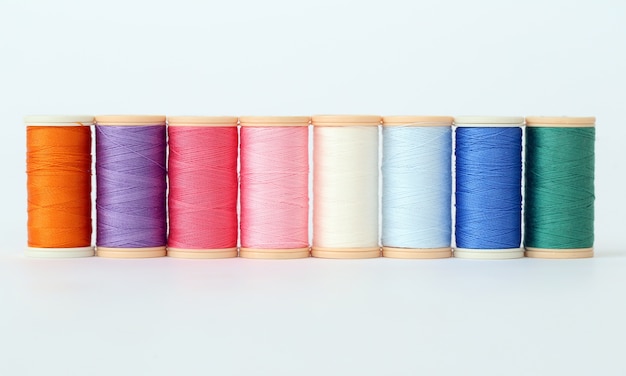 Free photo colorful threads on a white surface