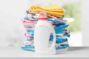 Free photo colorful towels and liquid laundry detergent