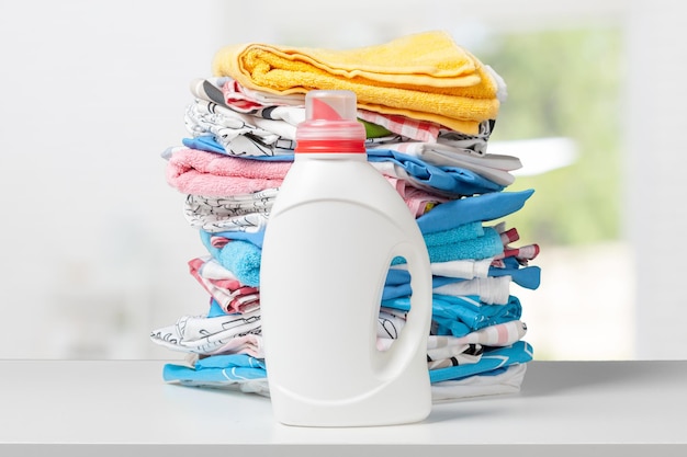 Colorful towels and liquid laundry detergent