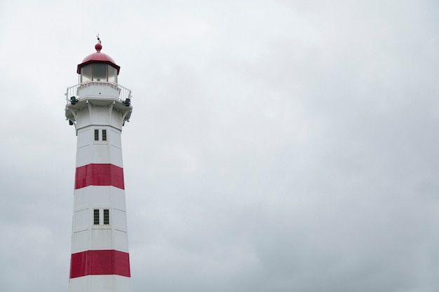 Colorful tower of lighthouse in overcast