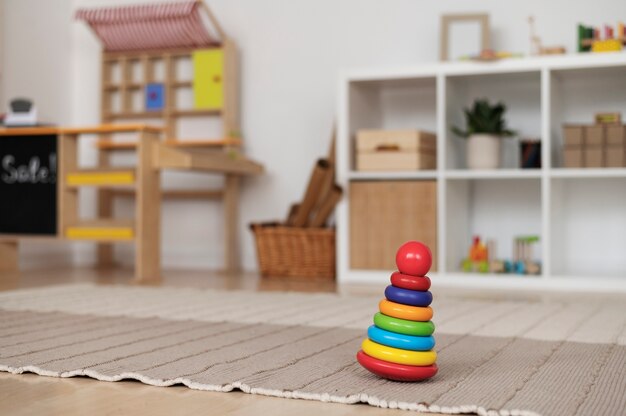 Colorful toy on carpet at home