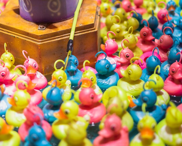 Colorful toy ducks in a water tank