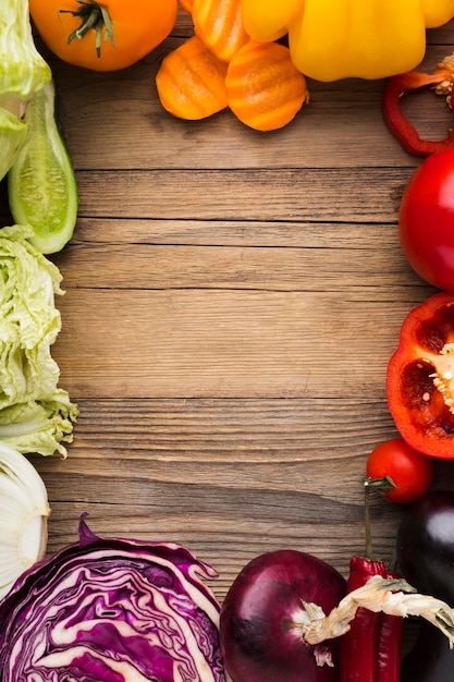 Colorful vegetables assortment on wooden background with copy space