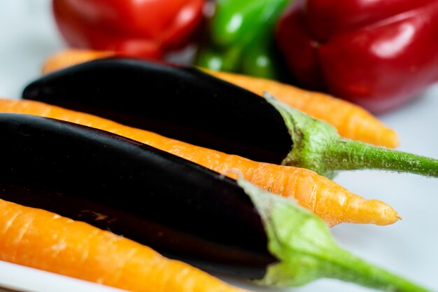 Free photo colorful vegetables fresh ripe mellow colored vegetables on white floor