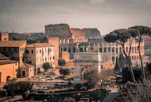 Free photo colosseum amphitheater in rome, italy under the grey sky