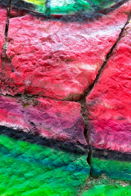 Free photo coloured painted broken wall