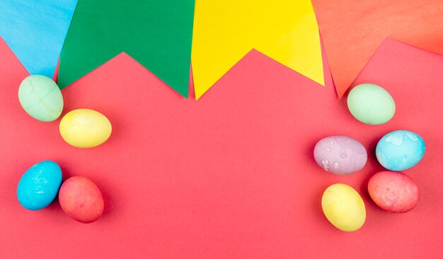 Colourful Easter eggs on red table