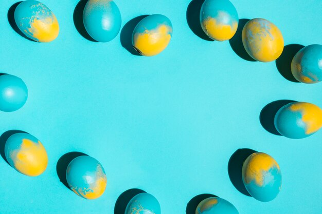 Colourful Easter eggs scattered on table