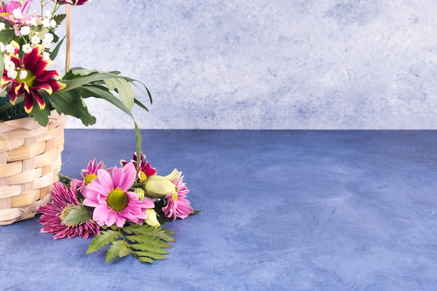 Colourful flowers and tropical plants in hamper