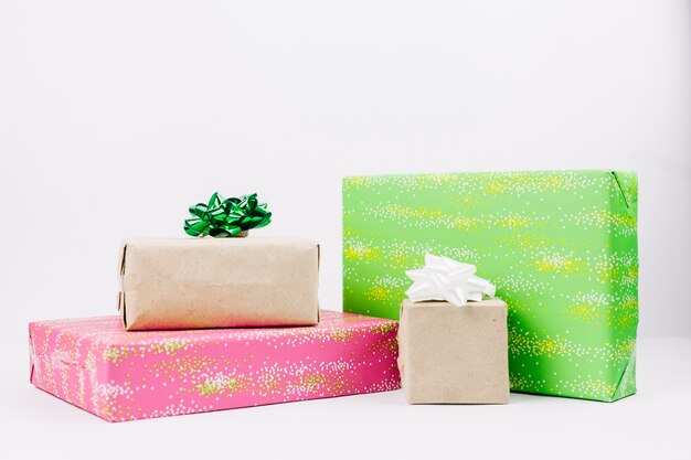 Colourful gift boxes with bows on table 