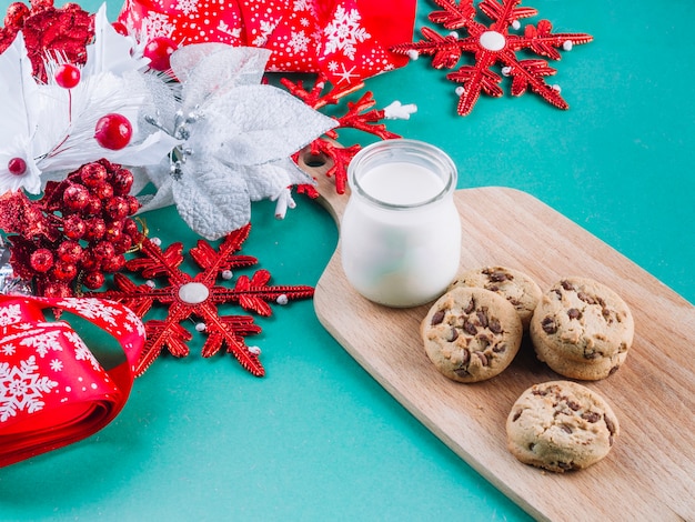 Colourful leaflets with cookies on table