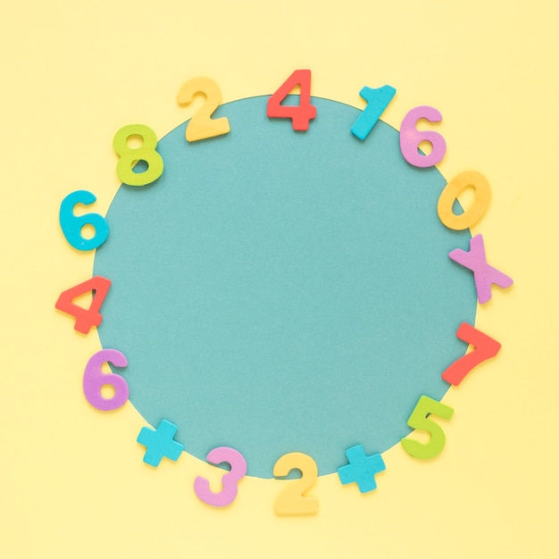 Colourful math numbers frame surrounding blue circular shape