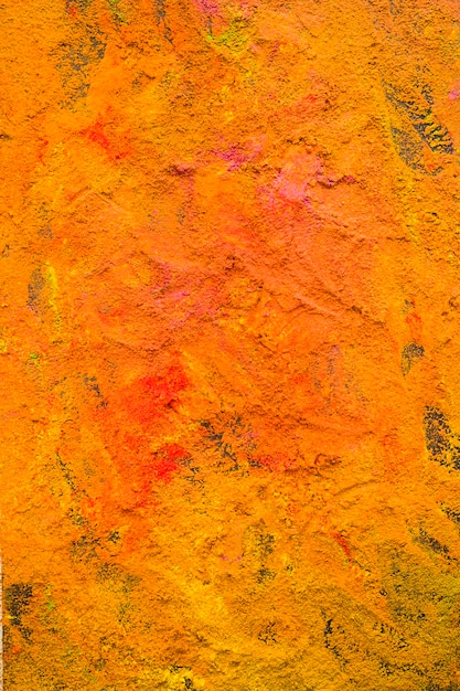 Free photo colourful orange powder on table