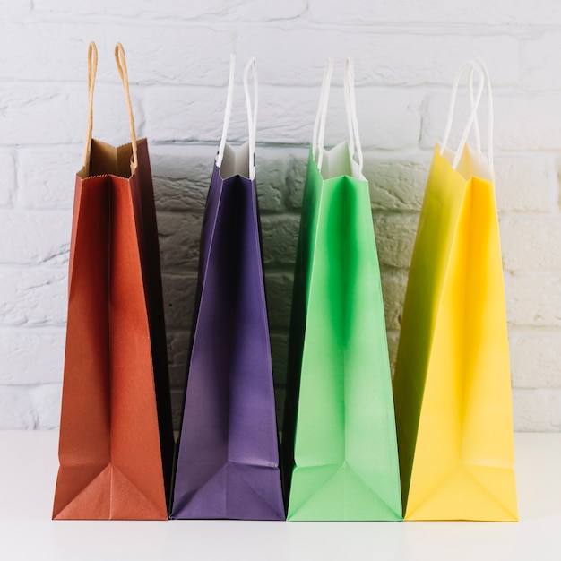 Free photo colourful shopping packets with handles