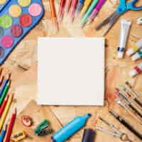 Free photo colourful wooden desk with stationery items