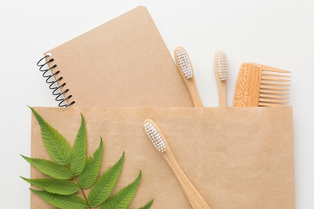 Free photo comb and notebook in ecology bag