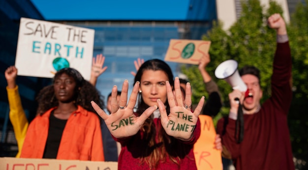 Community protesting outdoors medium shot