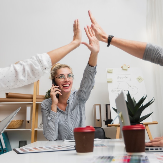 Company colleague high five