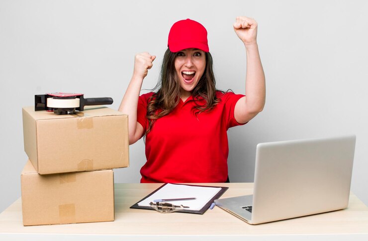 Free Photo company packer employee on a desk with a laptop