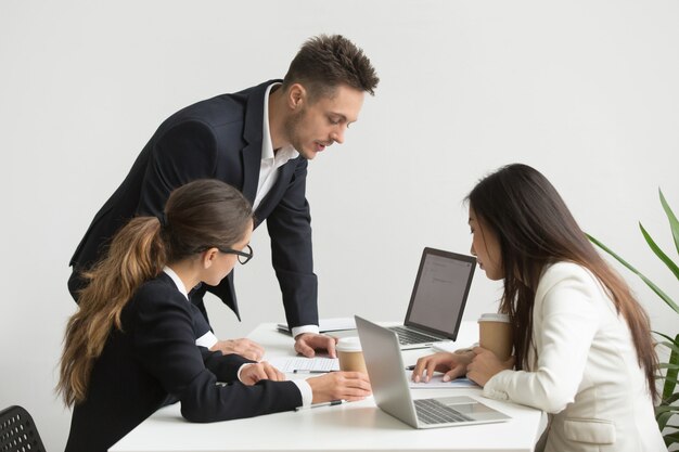 Company workers brainstorming during board meeting