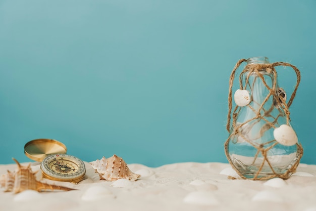 Free photo compass and bottle with rope