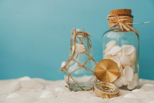 Compass in front of two bottles